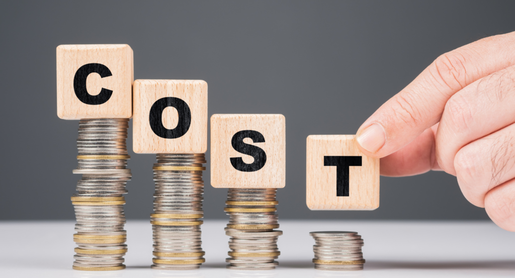 The word cost is balanced on coins. As the word cost is spelled out, the coins are decreasing in stack height.
